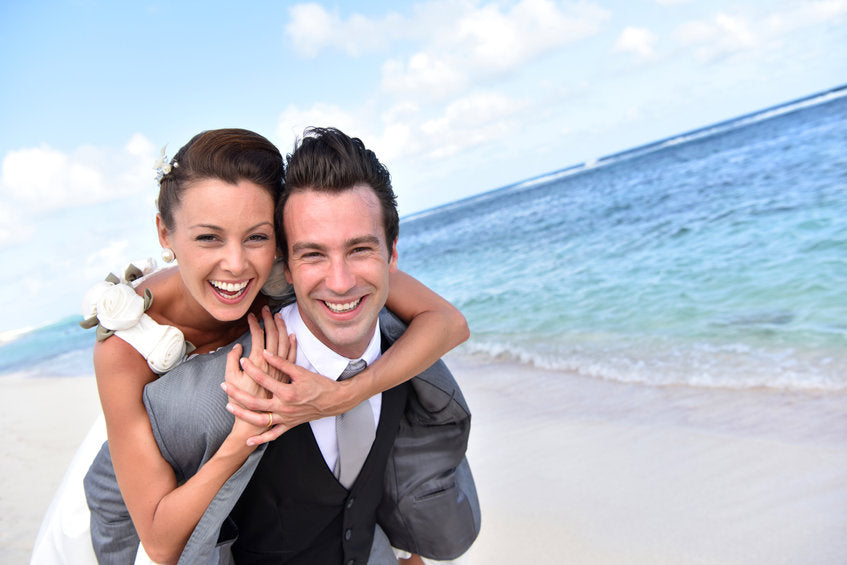 Portrait of smiling couple on the beach